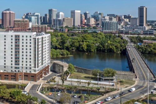 See breathtaking panoramic views of the James River and the historic Manchester neighborhood, showcasing the city's industrial past and modern revitalization